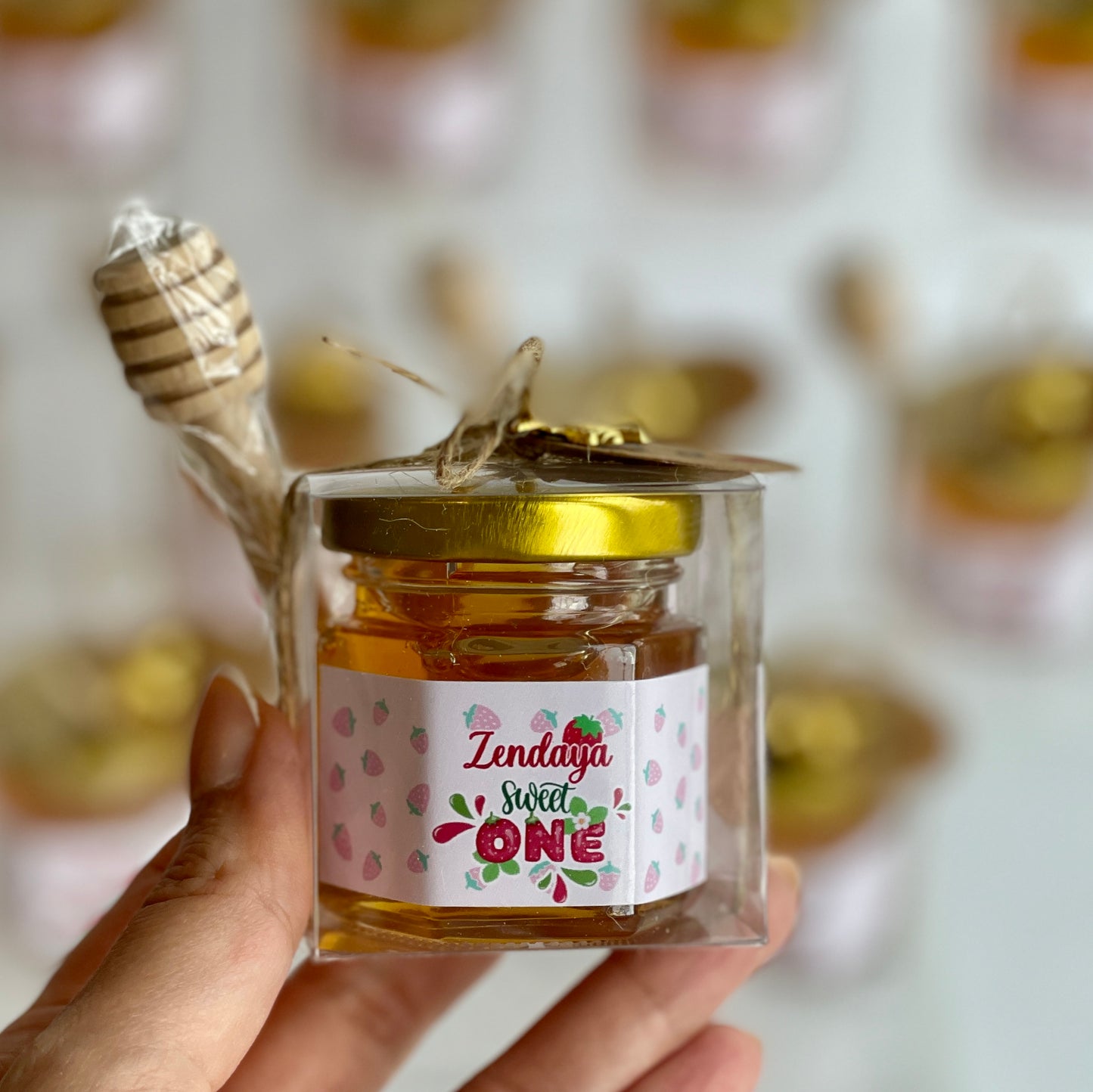 Strawberry honey jar with dipper